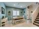 Bright dining area with a neutral color palette with modern farmhouse style and stairwell access at 4519 Sapphire Moon Ave, North Las Vegas, NV 89084