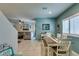 Open-concept dining area with natural light, neutral tones and tile flooring at 4519 Sapphire Moon Ave, North Las Vegas, NV 89084