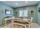 Beautifully staged dining area features a large dining table and decorations throughout the room at 4519 Sapphire Moon Ave, North Las Vegas, NV 89084