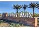 Entrance sign for Galaxy Park, with desert landscaping, stone monument, and palm trees under a clear blue sky at 4519 Sapphire Moon Ave, North Las Vegas, NV 89084
