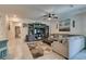 Spacious living room with tile floors, neutral paint, comfortable seating, and a ceiling fan at 4519 Sapphire Moon Ave, North Las Vegas, NV 89084