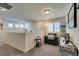 Cozy loft area featuring an accent chair, window, and stylish decor at 4519 Sapphire Moon Ave, North Las Vegas, NV 89084