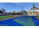 Net climber in the playground with slides and green space at 4519 Sapphire Moon Ave, North Las Vegas, NV 89084