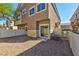 Enclosed backyard with gravel landscaping, patio, and fencing for privacy at 4779 Straight Flush Dr # 103, Las Vegas, NV 89122