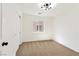 Inviting bedroom with carpet, modern lighting, and a large window with closet nearby at 4779 Straight Flush Dr # 103, Las Vegas, NV 89122