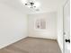 Cozy bedroom with carpet, contemporary lighting, and large window at 4779 Straight Flush Dr # 103, Las Vegas, NV 89122