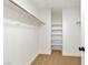 Walk-in closet with carpet, shelving, and clothes rod, offering ample storage space at 4779 Straight Flush Dr # 103, Las Vegas, NV 89122
