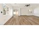 Modern living room with new wood flooring, large windows, and sliding door to a backyard patio at 4779 Straight Flush Dr # 103, Las Vegas, NV 89122