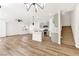 Inviting living space with new flooring, contemporary lighting, an open floorplan, and stairway access to upper floors at 4779 Straight Flush Dr # 103, Las Vegas, NV 89122