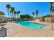 Inviting community pool features palm trees and a bathhouse, creating a relaxing atmosphere at 4779 Straight Flush Dr # 103, Las Vegas, NV 89122