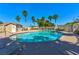Community pool featuring palm trees and a bathhouse, offering a refreshing oasis for residents at 4779 Straight Flush Dr # 103, Las Vegas, NV 89122