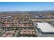 Vast residential community with distant mountains and a clear blue sky at 4786 Castel Martini Ct, Las Vegas, NV 89147
