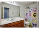 Bathroom with a shower and tub featuring cute Hello Kitty shower curtain, bright and cheerful at 4786 Castel Martini Ct, Las Vegas, NV 89147