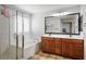 Spacious bathroom with a double vanity, a separate tub, and a glass-enclosed shower at 4786 Castel Martini Ct, Las Vegas, NV 89147