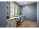 Cozy bedroom with a built-in desk and shelving, and bright window, perfect for a study area at 4786 Castel Martini Ct, Las Vegas, NV 89147