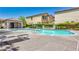 Inviting community pool area with a covered pavilion and lounge chairs at 4786 Castel Martini Ct, Las Vegas, NV 89147