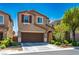 Well-maintained home with a two-car garage and tidy landscaping at 4786 Castel Martini Ct, Las Vegas, NV 89147