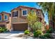 Charming two-story home with a well-maintained yard, two-car garage, and desert landscaping at 4786 Castel Martini Ct, Las Vegas, NV 89147