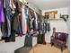 Walk-in closet with built-in shelving, hanging rods, and plenty of storage space at 4786 Castel Martini Ct, Las Vegas, NV 89147