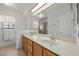Bright bathroom showcasing double sinks and a large mirror over the countertop at 5020 Linkside Dr, Las Vegas, NV 89130