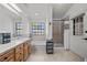 Bathroom with double vanity, large window, bathtub and separate shower at 5020 Linkside Dr, Las Vegas, NV 89130