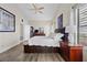 Spacious bedroom boasts a ceiling fan, neutral walls, and a large comfortable bed at 5020 Linkside Dr, Las Vegas, NV 89130