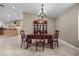 Formal dining room featuring an elegant table, chairs, and china cabinet and tile floors at 5020 Linkside Dr, Las Vegas, NV 89130