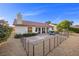 Inviting backyard featuring a patio, outdoor seating, lush greenery, and fenced perimeter at 5020 Linkside Dr, Las Vegas, NV 89130