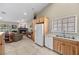 Open kitchen area featuring tile floors, oak cabinetry, and a view into the living room at 5020 Linkside Dr, Las Vegas, NV 89130