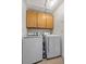 Functional laundry area with modern washer and dryer, plus ample storage space at 5020 Linkside Dr, Las Vegas, NV 89130