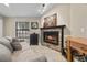 A cozy living room with a stone fireplace, creating a relaxing and inviting space at 5020 Linkside Dr, Las Vegas, NV 89130
