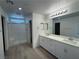Modern bathroom with a double sink vanity, and a glass-enclosed shower at 5163 Capucina St # Lot 3, Las Vegas, NV 89122