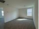 Cozy bedroom with soft carpeting and a sunny window at 5163 Capucina St # Lot 3, Las Vegas, NV 89122