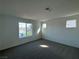 Sun-filled bedroom with plush carpeting and bright windows overlooking a view at 5163 Capucina St # Lot 3, Las Vegas, NV 89122