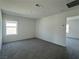 Spacious bedroom with neutral carpet and natural light from the window at 5175 Capucina St # Lot 5, Las Vegas, NV 89122