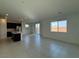 Bright living room featuring tile floors, recessed lighting, and large windows overlooking the backyard at 5175 Capucina St # Lot 5, Las Vegas, NV 89122
