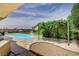 Backyard oasis with pool, outdoor kitchen, and charming pergola, perfect for relaxation and entertaining at 5500 Santovito St, Pahrump, NV 89061