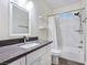 Bathroom features tiled shower, modern fixtures, and a sleek vanity with neutral countertops at 5500 Santovito St, Pahrump, NV 89061