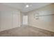 A well-lit bedroom with carpet, closet and additional shelving at 5500 Santovito St, Pahrump, NV 89061