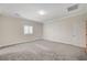 Bedroom with neutral carpet, a bright window, and white trim at 5500 Santovito St, Pahrump, NV 89061