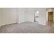 Comfortable bedroom with carpet, closet, and view to an ensuite bath at 5500 Santovito St, Pahrump, NV 89061