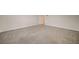 Large neutral carpeted bedroom with a door to the closet or hallway at 5500 Santovito St, Pahrump, NV 89061