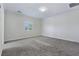 Neutral bedroom with carpet and a bright window at 5500 Santovito St, Pahrump, NV 89061