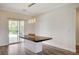 Dining Area features a modern light fixture and sliding glass door to patio at 5500 Santovito St, Pahrump, NV 89061
