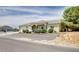 A single-story home featuring a well-maintained lawn with desert landscaping elements and a multi-car garage at 5500 Santovito St, Pahrump, NV 89061