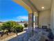 Inviting front porch with a seating area and desert landscape, perfect for enjoying outdoor living at 5500 Santovito St, Pahrump, NV 89061