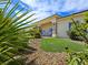 Charming home with green grass, decorative rocks, tasteful landscaping, and a welcoming front porch at 5500 Santovito St, Pahrump, NV 89061