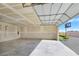 Bright garage with partially opened door and unfinished drywall, ready for customization at 5500 Santovito St, Pahrump, NV 89061