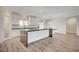 Bright kitchen with island, white cabinets, and stainless steel appliances at 5500 Santovito St, Pahrump, NV 89061