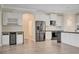 Well-designed kitchen with stainless steel appliances and white cabinets at 5500 Santovito St, Pahrump, NV 89061